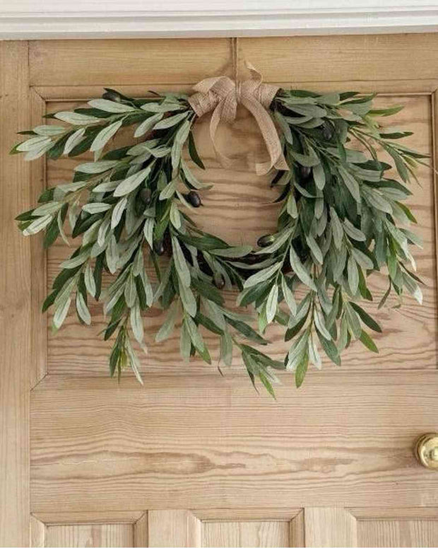 Faux olive stem wreath with realistic green foliage, perfect for decorating walls or doors in a natural style.