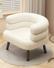 Cream boucle curved chair with wooden legs from Starlight Express, showcasing its plush upholstery and modern design.