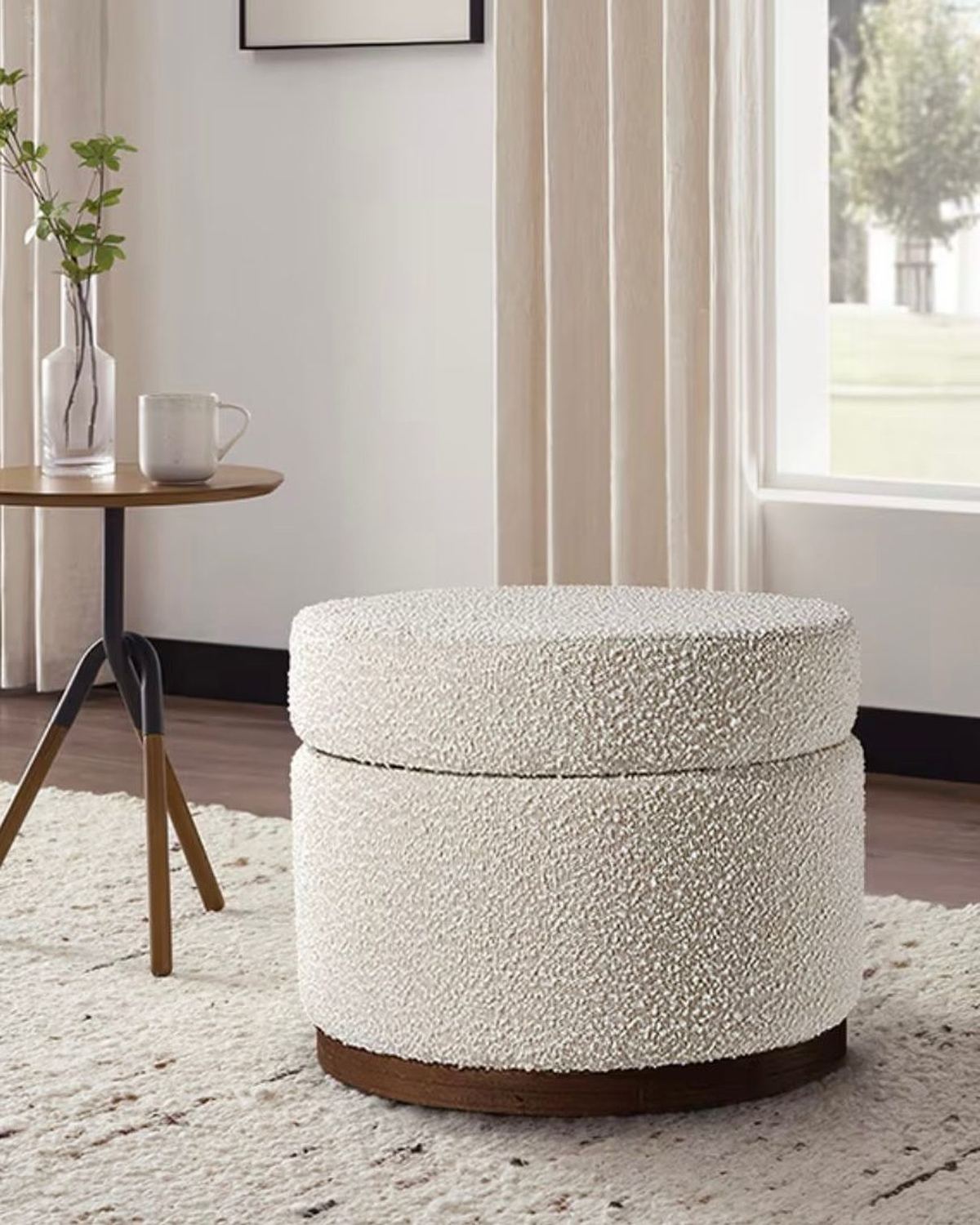 Cream boucle round storage foot stool from Starlight Express, featuring soft fabric and a compact, functional design.