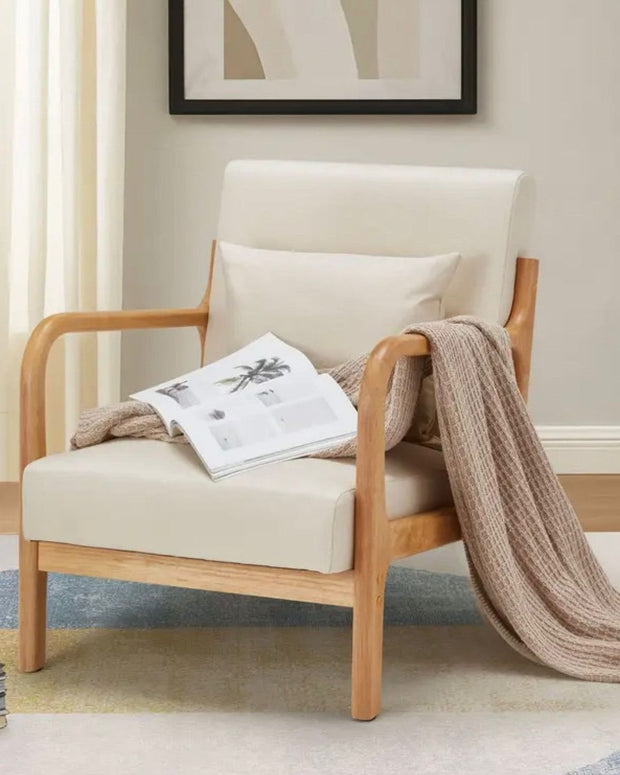Cream retro wooden framed arm chair by Starlight Express, showing a cozy, vintage-style furniture piece with plush cushioning.