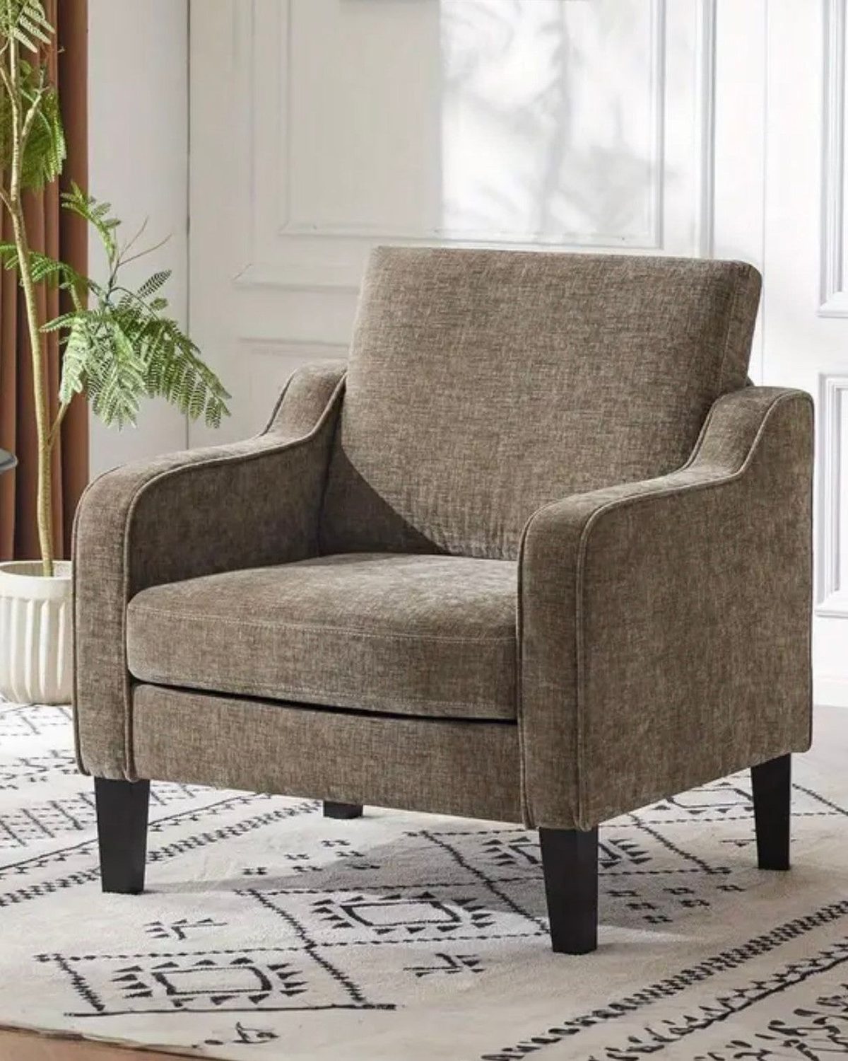 Light brown small tub chair from Starlight Express, modern furniture piece with plush upholstery and compact design.