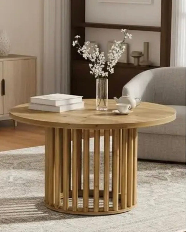 Rustic natural open slatted round wood coffee table by Starlight Express, showcasing its round shape and open slatted design in a furniture setting.