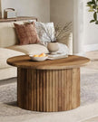 Rustic natural round closed slatted wood coffee table by Starlight Express, featuring a sturdy wooden surface and slatted design.