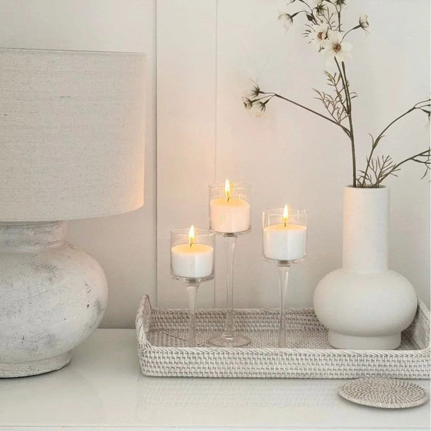 Set of three stemmed glass candle holders for home decor by Starlight Express, featuring elegant transparent glass designs.