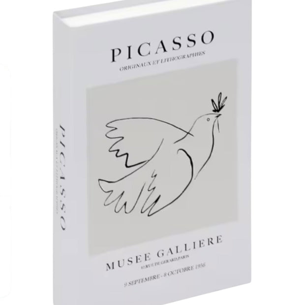 White and black Picasso-style storage book box by Starlight Express, ideal for home decor and organization.