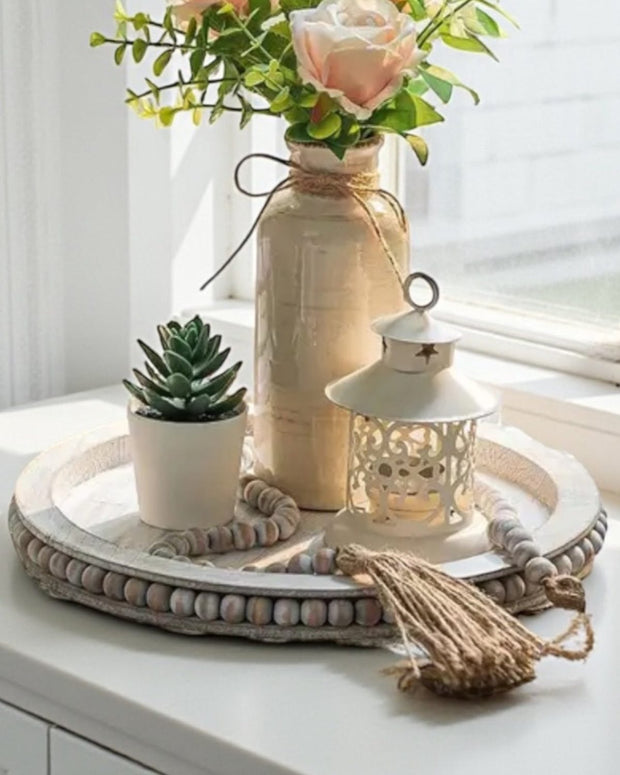 White wood beaded round tray with matching beaded tassel, ideal for home decor, by Starlight Express.