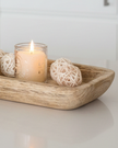 Starlight Express wooden dough bowl kitchen tray used as a rustic home decor piece with a smooth finish and natural wood grain.