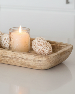Starlight Express wooden dough bowl kitchen tray used as a rustic home decor piece with a smooth finish and natural wood grain.