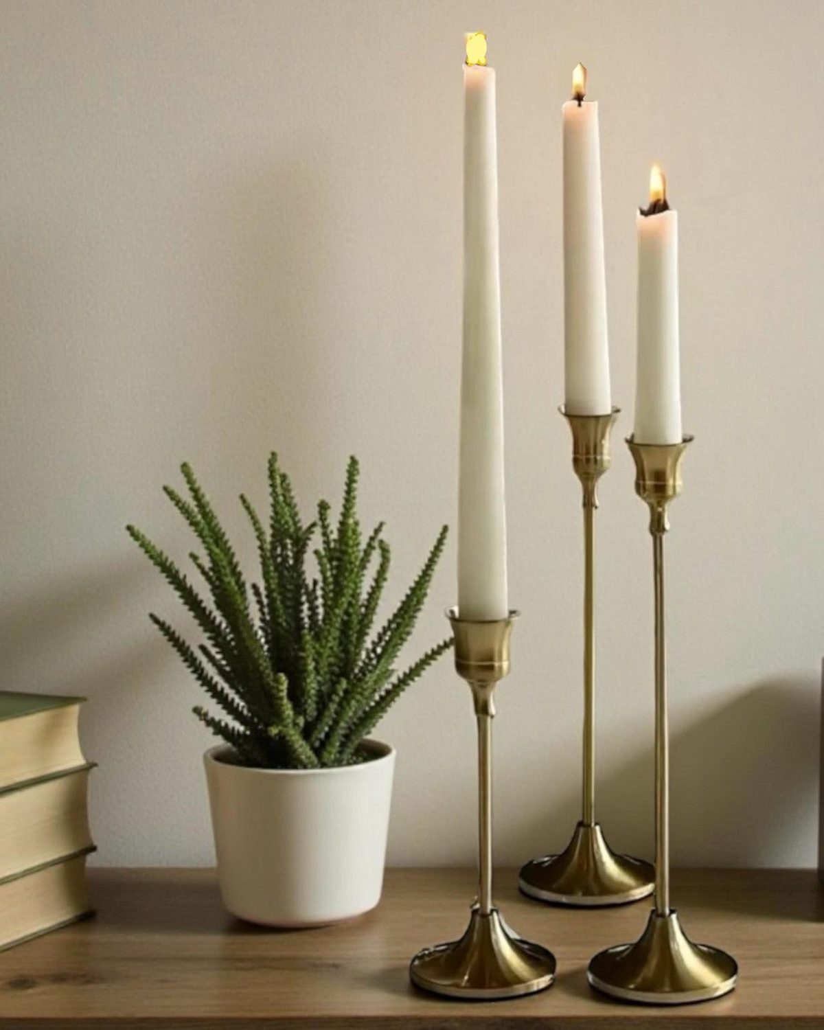 Antique brass effect taper candlestick for home decor, featuring a classic design and warm metallic finish by Starlight Express.