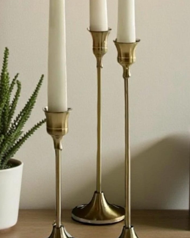 Antique brass effect taper candlestick from Starlight Express, elegant home decor piece with a vintage style and classic design.