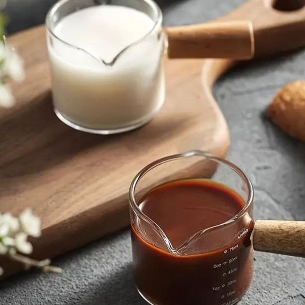 Glass milk and coffee jug pourer with wooden handle by Starlight Express, ideal for kitchen and dining use