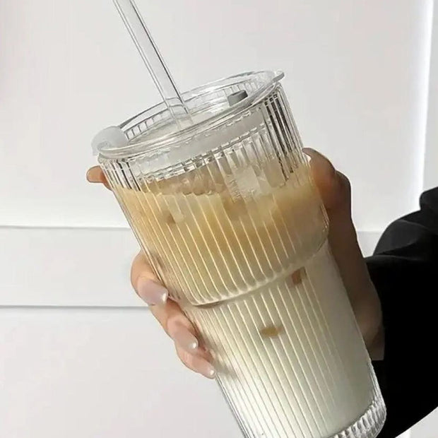 Large ribbed glass ice coffee tumbler with lid by Starlight Express, ideal for cold beverages in kitchen and dining settings.