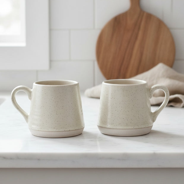 Set of two natural ceramic espresso cups by Starlight Express, ideal for stylish kitchen and dining use.