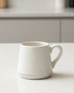 Set of two natural ceramic espresso cups by Starlight Express, ideal for stylish kitchen and dining use.