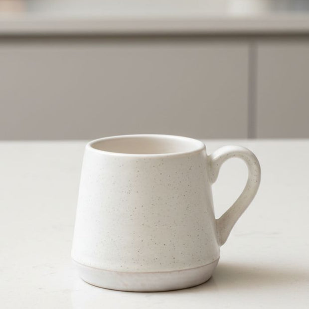 Set of two natural ceramic espresso cups by Starlight Express, ideal for stylish kitchen and dining use.