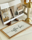Dark wood book stand by Starlight Express, rustic home decor piece suitable for kitchen or dining room wall display.