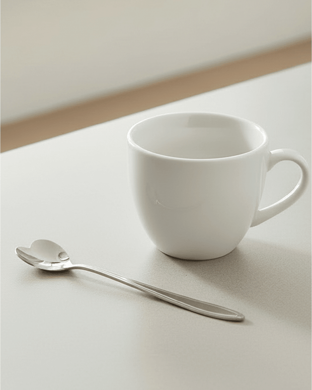 Silver hearts latte coffee tea spoon from Starlight Express, elegant kitchen utensil for stirring beverages.