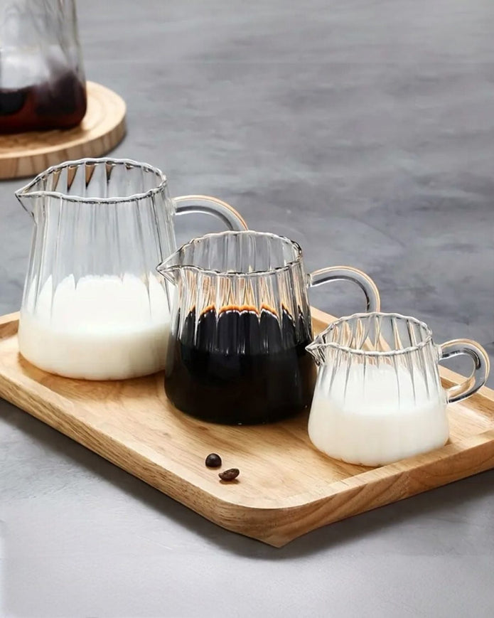 Mini ribbed glass jugs for kitchen and dining by Starlight Express, showcasing small, textured glass containers for beverages or decor.