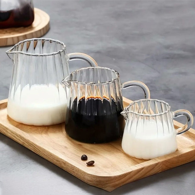 Mini ribbed glass jugs for kitchen and dining by Starlight Express, showcasing small, textured glass containers for beverages or decor.