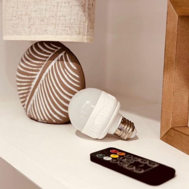 Set of two Starlight Express LED screw-in lighting bulbs with USB rechargeable feature for versatile indoor lighting.