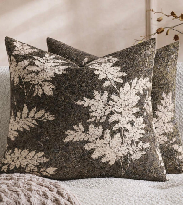 Brown and olive green leaf cushion cover from Starlight Express, made of soft furnishings fabric with a natural leaf pattern.