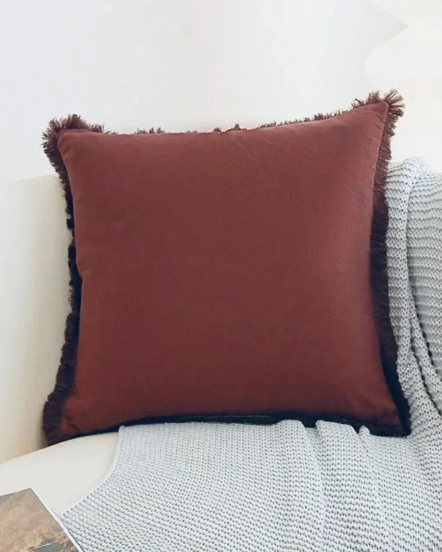 Burgundy frayed edge cushion cover from Starlight Express, soft furnishings with textured frayed edges for cozy decor.
