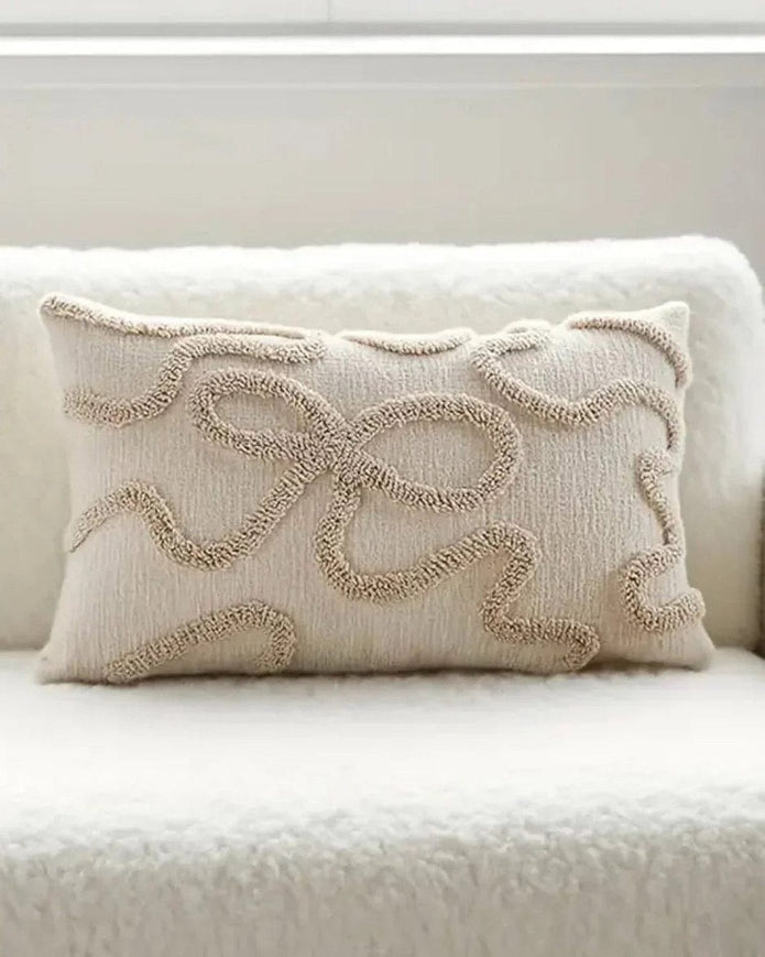 Cream and beige bow rectangle boucle cushion cover by Starlight Express, featuring soft fabric and stylish design.