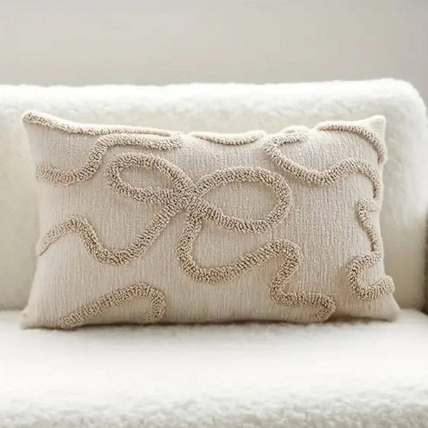 Cream and beige bow rectangle boucle cushion cover by Starlight Express, featuring soft fabric and stylish design.