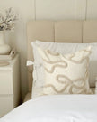 Cream and beige bow square boucle cushion cover by Starlight Express, soft furnishings with a textured boucle fabric and decorative bow detail.