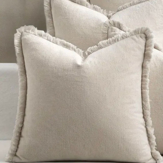 Neutral frayed edge cushion cover from Starlight Express, soft furnishings with textured fabric and stylish design.