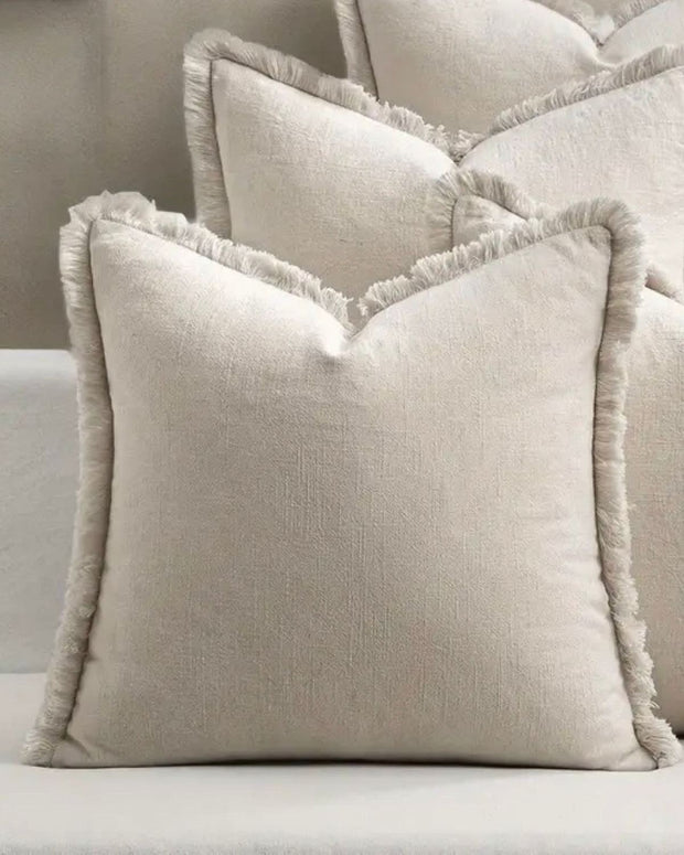 Neutral frayed edge cushion cover from Starlight Express, soft furnishings with textured fabric and stylish design.