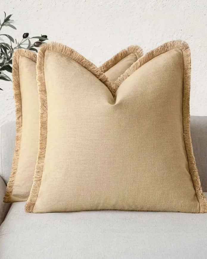 Ochre cushion cover with frayed edges from Starlight Express, soft furnishings accessory with stylish, textured design.