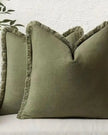 Olive green cushion cover with frayed edges by Starlight Express, made from soft furnishings material, showcasing a textured design.