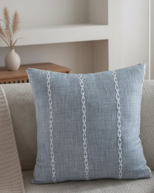 Ocean blue woven line design cushion cover from Starlight Express, soft furnishings with textured fabric and stylish pattern.