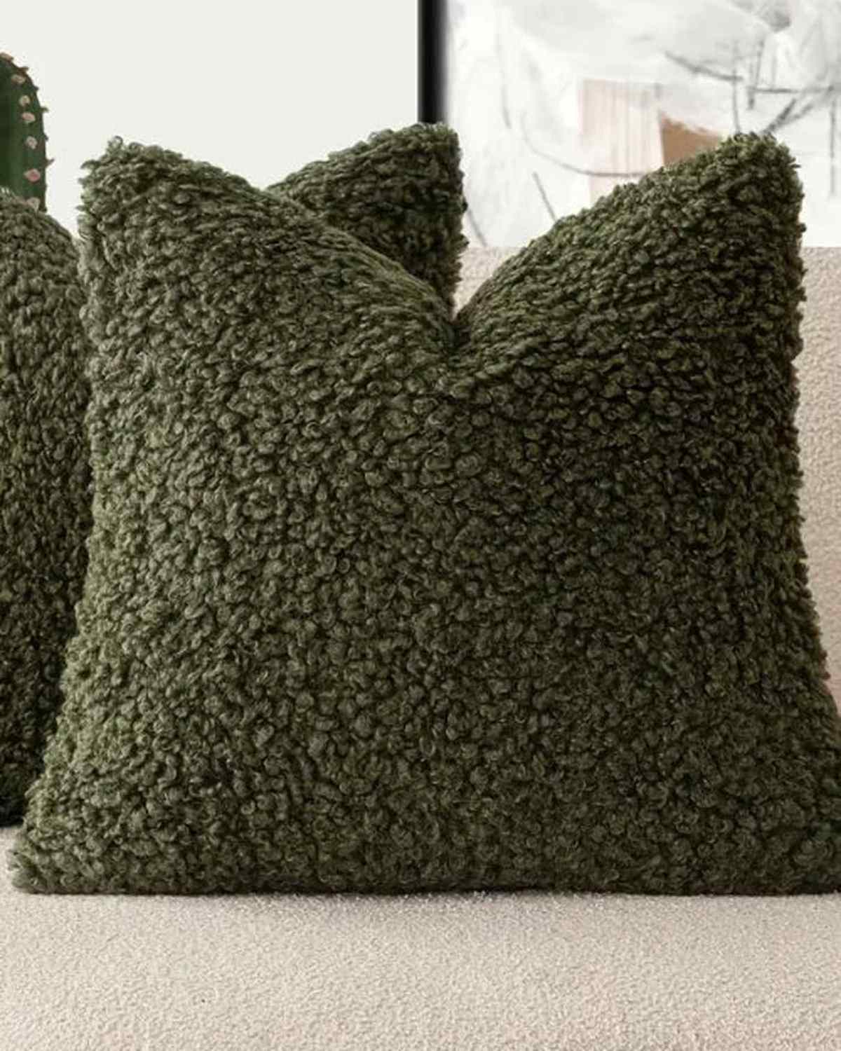 Olive green boucle cushion cover by Starlight Express, soft furnishings with textured fabric and cozy design.