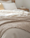 Beige checkered chenille chunky knit blanket throw from Starlight Express, soft and cozy for living room or bedroom decor.
