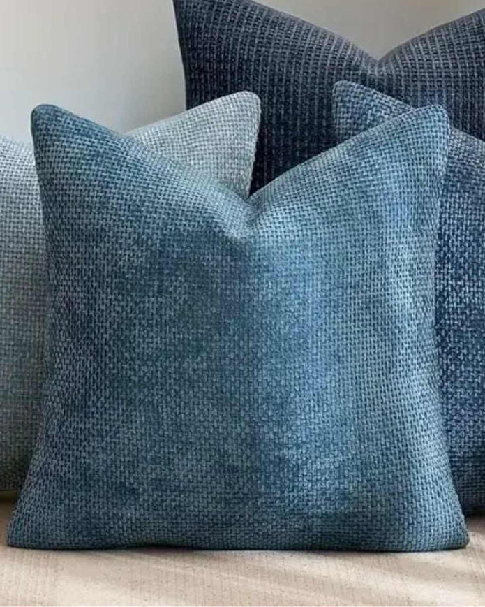 Teal blue woven design cushion cover by Starlight Express, soft furnishings, with textured fabric and decorative woven pattern.