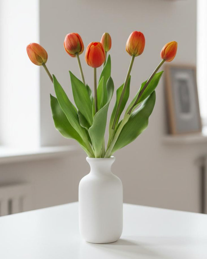 Bunch of 5 artificial tulip stems in golden sunrise color, from Starlight Express, showcasing spring flower blooms.