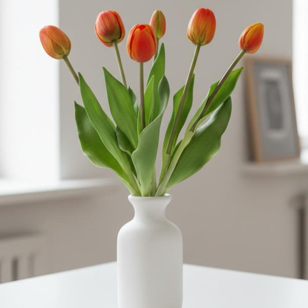 Bunch of 5 artificial tulip stems in golden sunrise color, from Starlight Express, showcasing spring flower blooms.