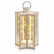 Full studio view of the cream star-shaped Starlight lantern with warm lights.