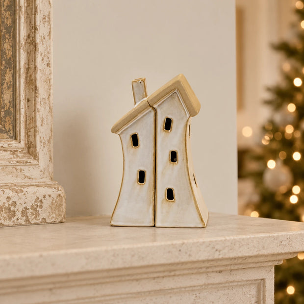 Satchville stone-glazed ceramic twin house Christmas ornament on a mantelpiece