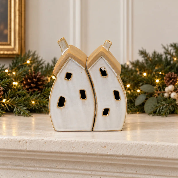 Satchville stone-glazed ceramic twin house Christmas ornament displayed on a mantel