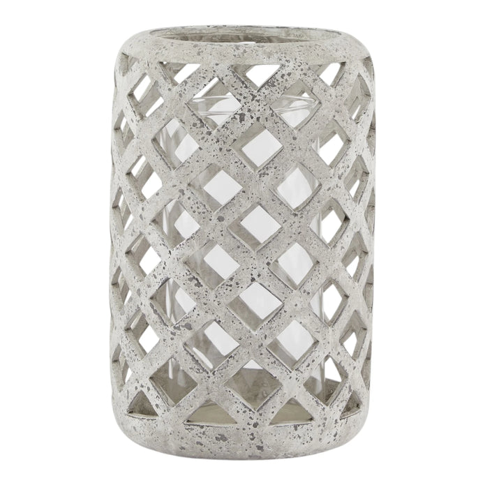 Stone lattice hurricane lantern for home decor by Hill Interiors, featuring a textured stone exterior and glass interior for ambient lighting.