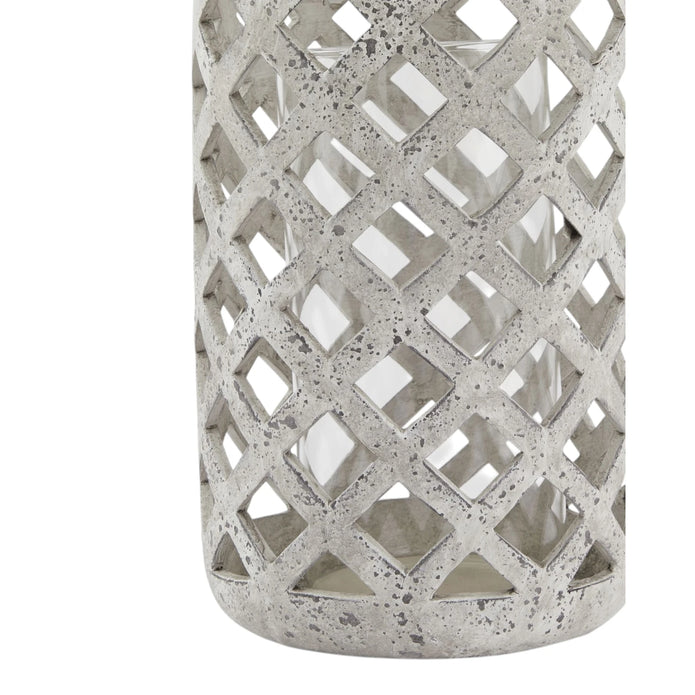 Stone lattice hurricane lantern for home decor, featuring intricate stone detailing and a glass enclosure for candle display.