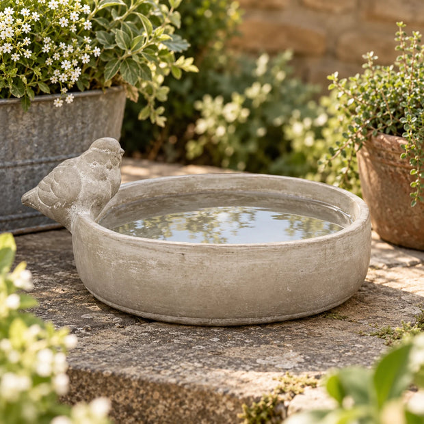Satchville stoneware bird bath bowl for garden decor, featuring a round, textured ceramic design suitable for outdoor bird habitats.