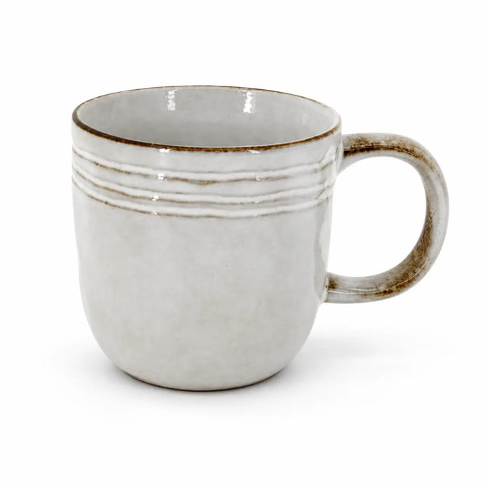 Single empty stoneware coffee mug with brown rim and curved handle on white