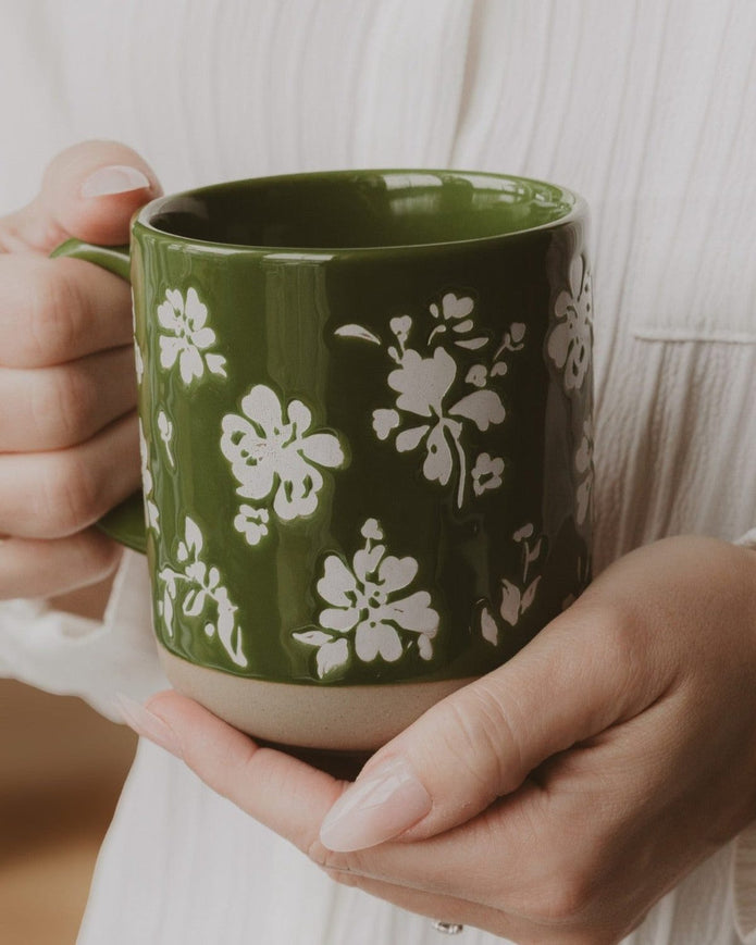 Green floral stoneware coffee mug by Sweet Water Decor, featuring a decorative design for kitchen and dining use.