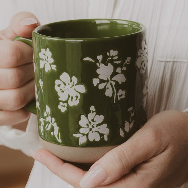 Green floral stoneware coffee mug by Sweet Water Decor, featuring a decorative design for kitchen and dining use.