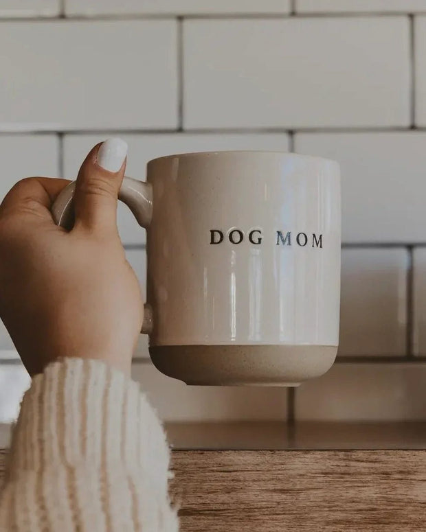 Cream glazed ceramic mug from Sweet Water Decor with "Dog Mom" design, perfect for kitchen and dining use.