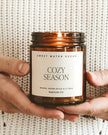 Sweet Water Decor Warm and Cozy Candle - Brown Glass - Seasonal Decor - AutumnSeasonal Decor - Autumn - Lulu Loves Home